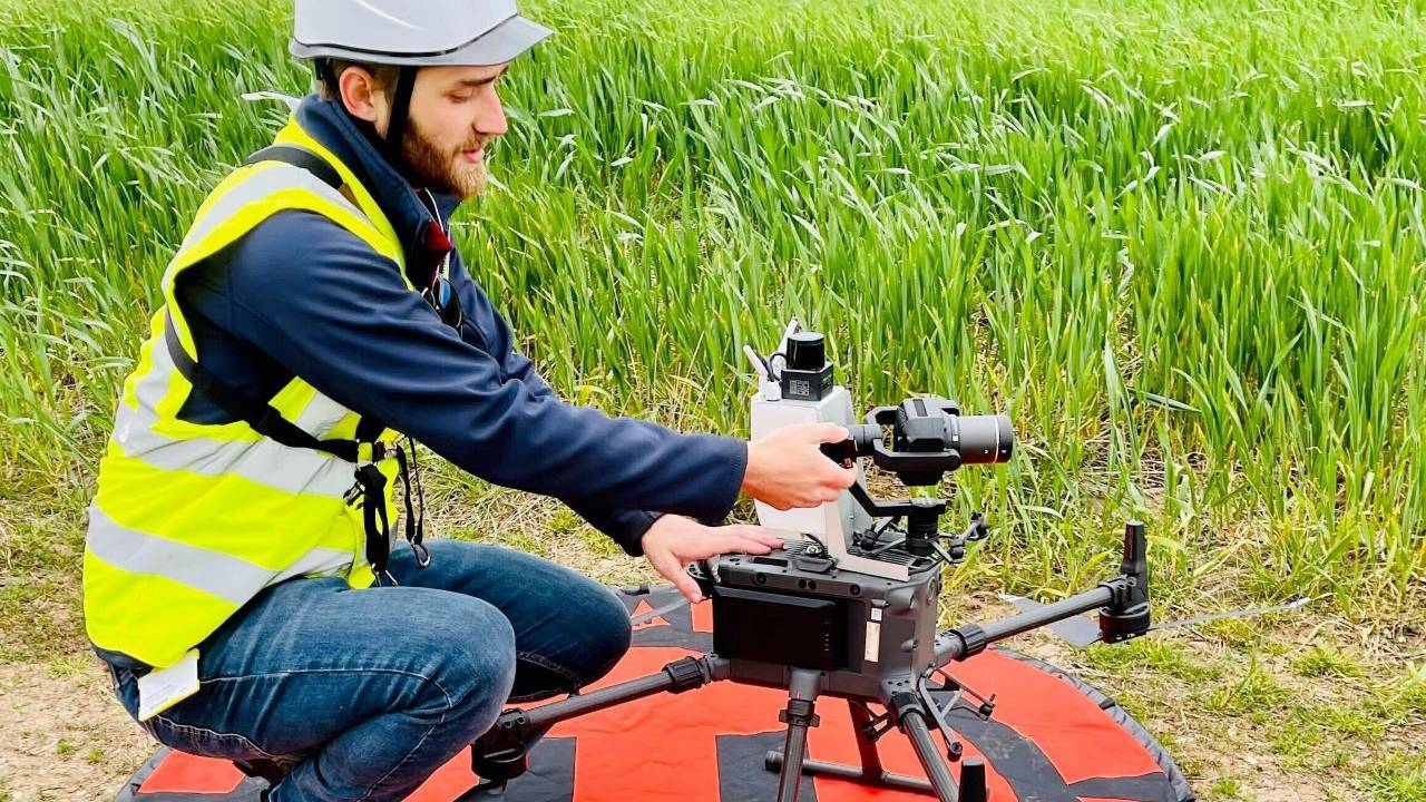 This is a photo of Ben positioning our drone before deployment. 